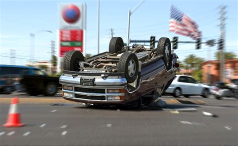 A dramatic illustration of an SUV rollover accident